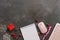 Christmas or New Year`s women workspace. Blank notepad, modern keyboard, mouse and Christmas decorations on a dark rustic