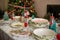 Christmas and New Year table place setting with empty Christmas plates with festive decorations bauble snowflake star bow ball pi