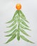 Christmas and new year tree made of eucaliptus leaves mandarin on light grey background. Flat lay. Holiday concept