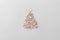 Christmas and new year tree made of wooden stars on light grey background. Minimalistic clean bright style