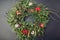 Christmas and New Year wreath made of fir, pine, mistletoe branches, cones decorated with red ornaments