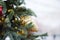 Christmas New Years background. Branches of a Christmas tree with a bump close-up on the street. Blurry, selective focus