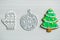 Christmas, new years decor on a wooden white background. Gingerbread mitten, a ball, lump, nut.