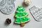 Christmas, new years decor on a wooden white background. Gingerbread mitten, a ball, lump, nut.