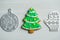 Christmas, new years decor on a wooden white background. Gingerbread mitten, a ball, lump, nut