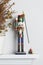 Christmas nutcracker solider broken with dead pine tree