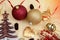 Christmas objects, balls tree and ribon on golden background