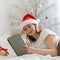 Christmas online congratulations. Smiling woman in santa hat