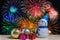 Christmas ornament and toy doll on fireworks backgrounds