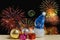 Christmas ornament and toy doll on fireworks backgrounds