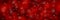 Christmas panoramic red background with snowflakes and bokeh