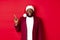 Christmas, party and holidays concept. Excited and amused Black man pointing finger left and smiling, showing logo