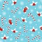 Christmas pattern with holly berries, candy canes, xmas socks snowflakes, snow balls on blue background. Happy New Year