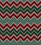 Christmas pattern. Knitted zigzag in red, green, white. Seamless chevron texture.