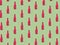 Christmas pattern made with pink champagne bottle and glass on bright light green background.