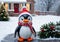 A Christmas Penguin Decoration In A Snowy Yard, At Noon. Generative AI