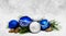 Christmas perfect decoration blue and silver balls isolated on golden blurred bokeh background