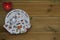 Christmas photography image of Santa mince pie plate showing eaten carrot from reindeer and empty plate with heart lit candle