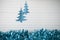 Christmas photography image of xmas decoration hanging up blue glitter xmas tree and blue tinsel and white wood background