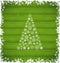 Christmas pine and border made of snowflakes on green wooden ba