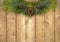Christmas Pine Garland on a Rustic Wood Fence