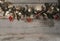 Christmas pine tree garland with red baubles, candy canes and ornaments, hanging on old wooden board background