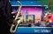 Christmas pink illustration with saxophone player on cityscape of London background