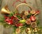 Christmas poinsettias, pine cones, evergreen, green vases, horn.   Wreath