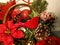 Christmas poinsettias, pine cones, evergreen, green vases, horn.   Wreath