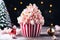 Christmas popcorn in a striped basket on a dark background with bokeh