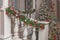 Christmas porch decoration idea. House entrance decorated for holidays. Red and green wreath garland of fir tree