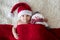 Christmas portrait of cute little newborn baby boy, wearing santa hat