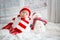 Christmas portrait of cute little newborn baby boy, wearing santa hat