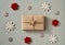 Christmas present wrapped in ecological recycled paper with wooden decoration - zero-waste concept