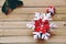 Christmas presents laid on a wooden table background with snowflake