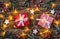 Christmas presents with white wooden stars and lights.