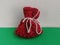 Christmas red bag tied with a white thread