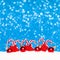 Christmas red balls and candy in snow on blue