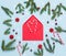 Christmas red empty envelope, fir tree branches, red cranberries and candy canes on pastel blue background