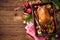 Christmas roast duck with apples and oranges on baking tray