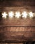 Christmas rustic background with lights and free text space. Festive vintage planked wood with copyspace