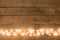 Christmas rustic background - vintage planked wood with lights and free text space