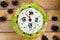 The Christmas salad rice olives greens peas - concept New year clock face, midnight, brown wooden background spruce