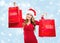 Christmas SALE - woman holding a red sale bags