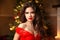 Christmas Santa. Beautiful smiling woman model. Makeup. Healthy