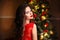 Christmas Santa. Beautiful smiling woman model. Makeup. Healthy