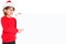 Christmas Santa Claus child kid girl pointing looking empty banner copyspace