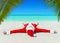 Christmas Santa Claus sunbathe at tropical ocean palm sandy beach