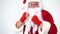 Christmas. Santa Claus on a white background in red bows for boxing and kickboxing fulfills blows. The image of a