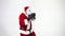 Christmas. Santa Claus on a white background wears black boxing gloves and fulfills punches. Kickboxing, fighter.